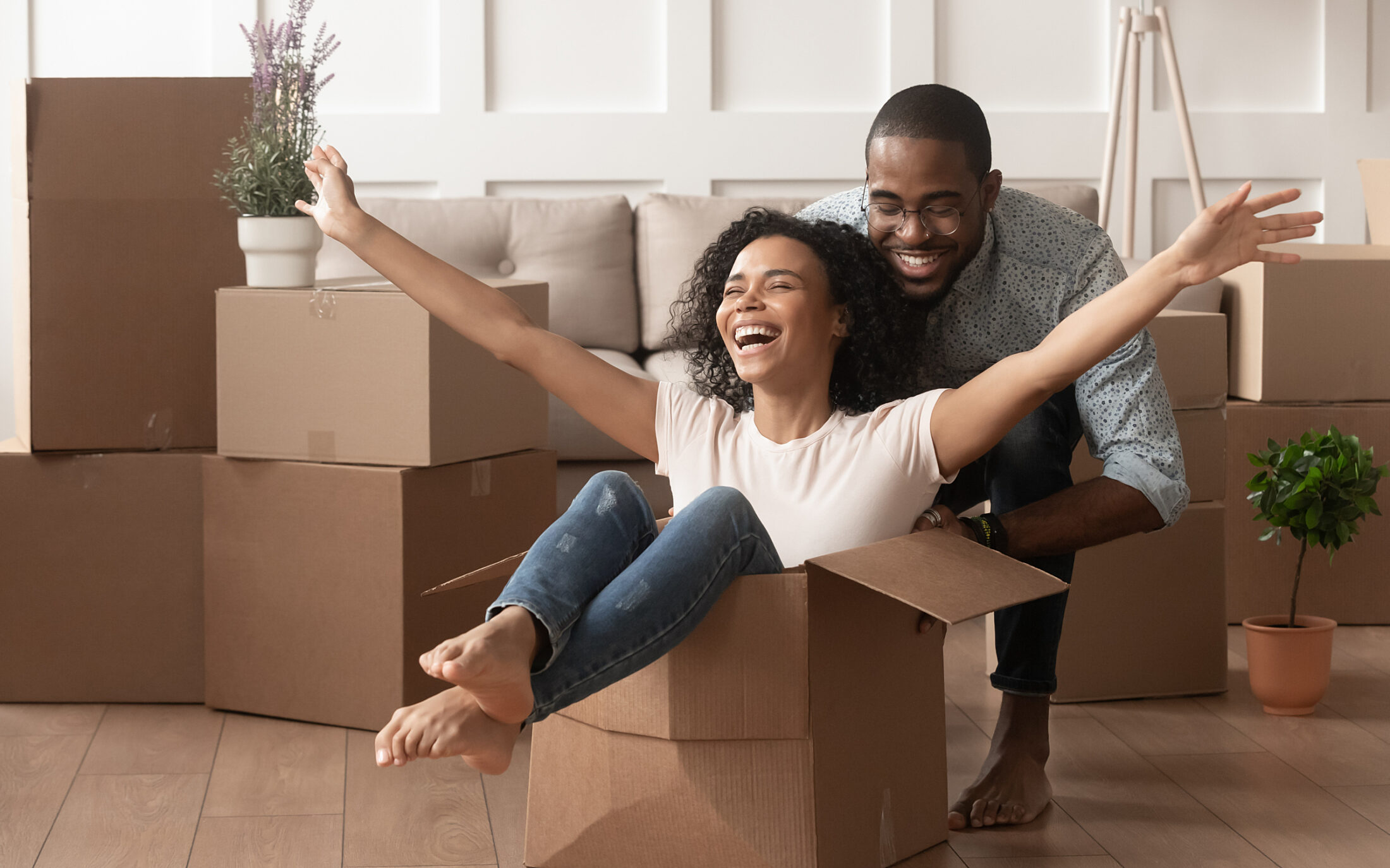 Couple young moving house conveyancing happy playing 1414418570