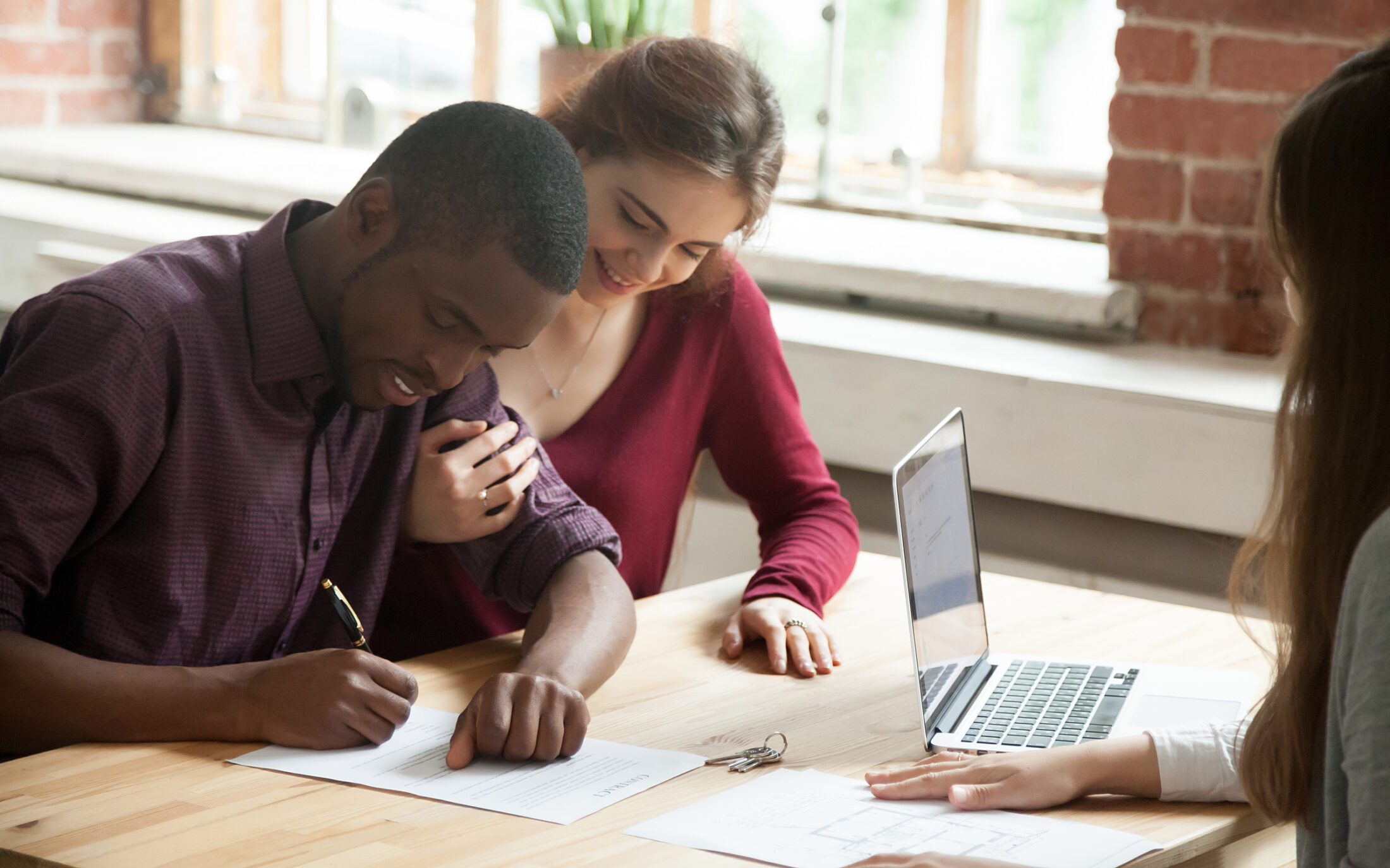 Couple young signing contracts 727180936